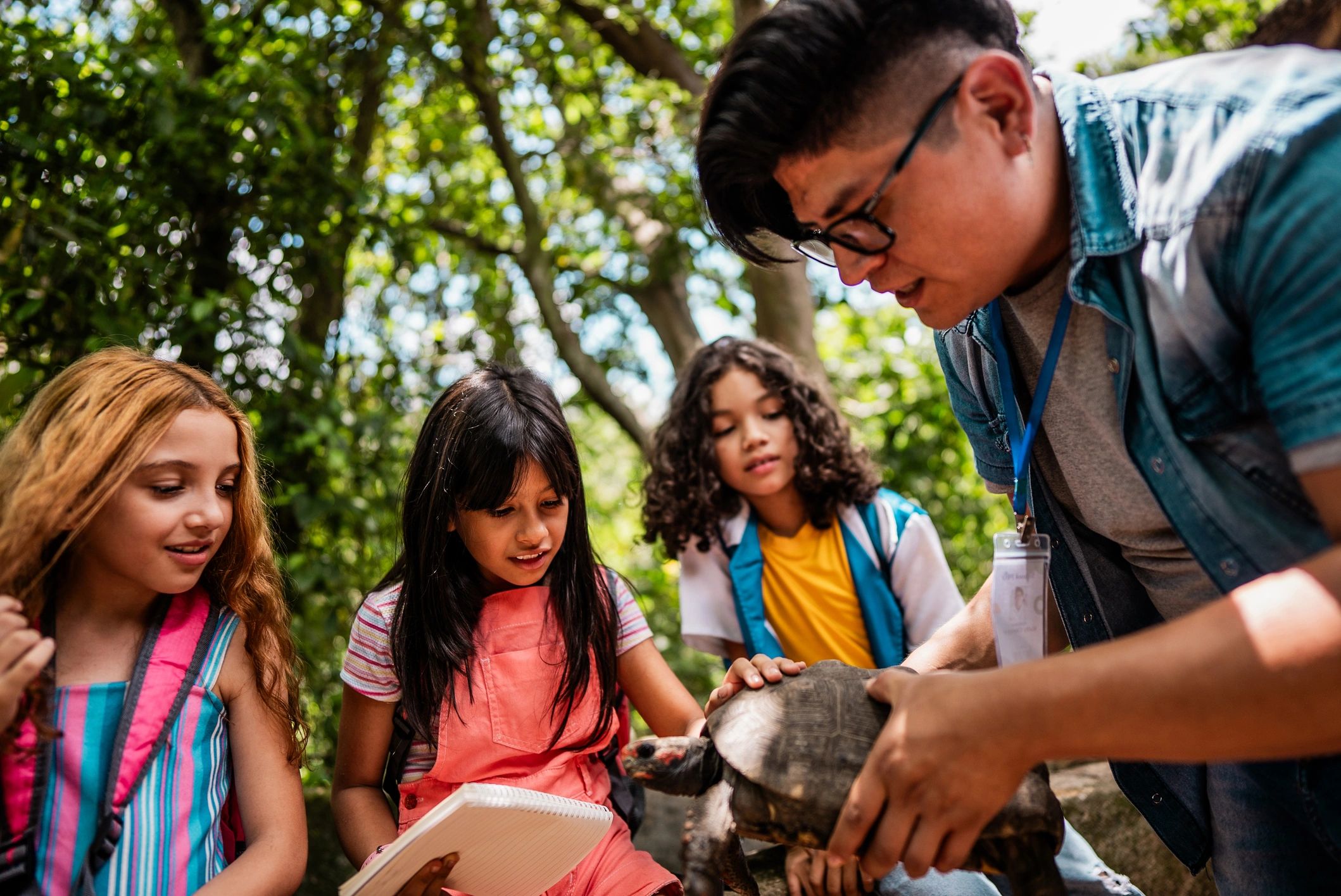 Children learning together during an outdoor educational activity