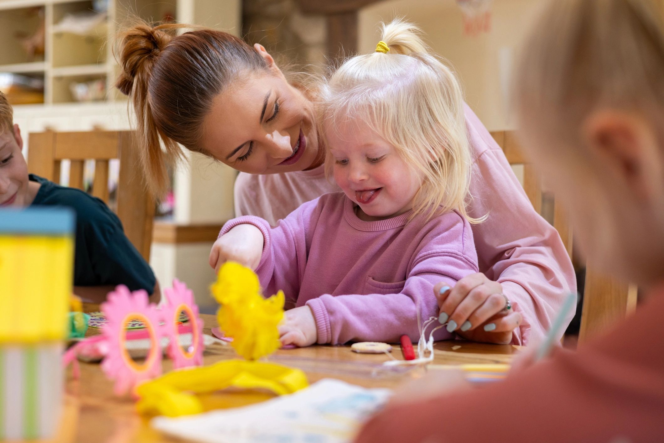 Children participating in a creative hands-on activity together