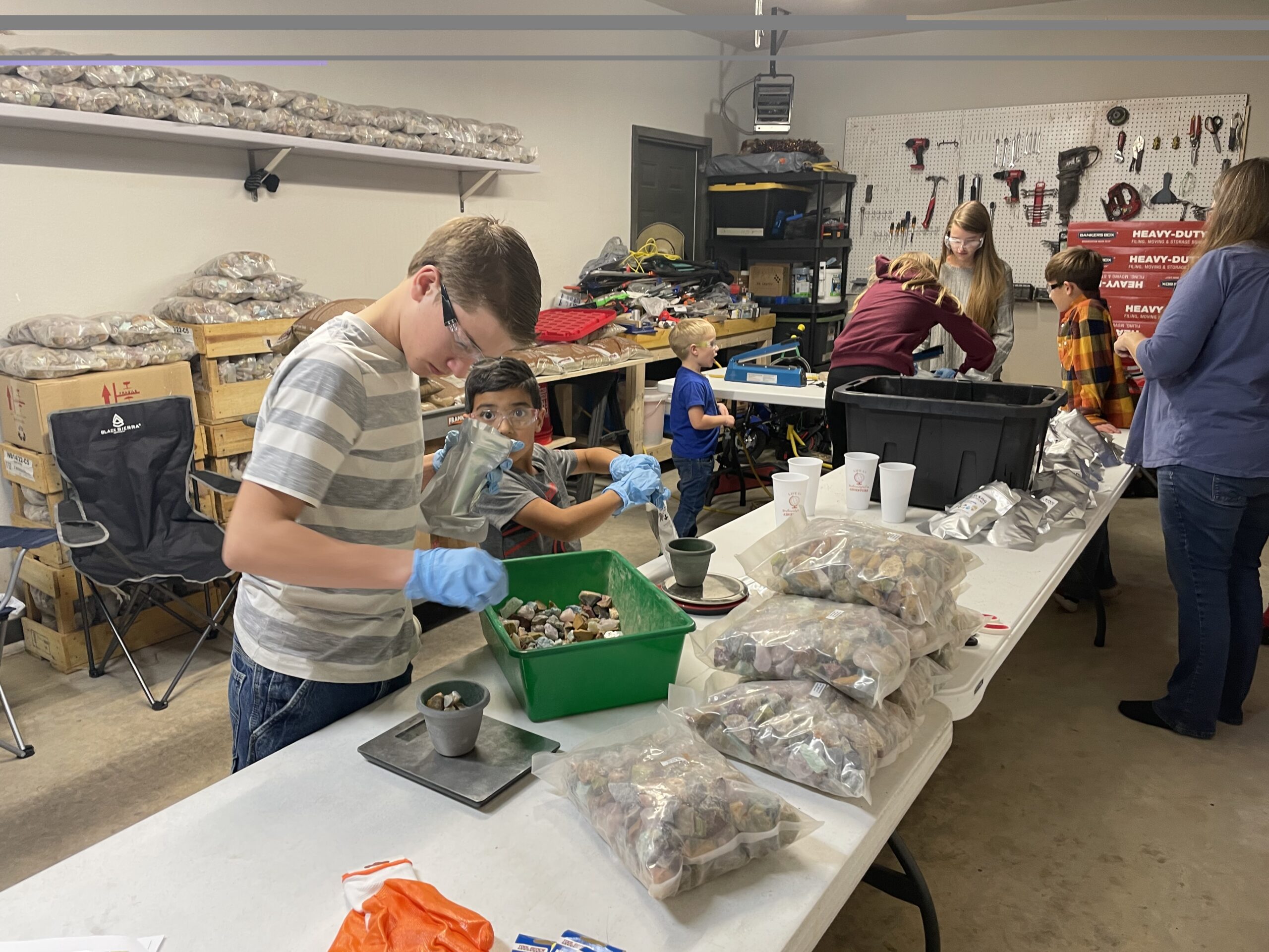 Volunteers assembling mineral kits for the Rocking Adventures Christmas Program